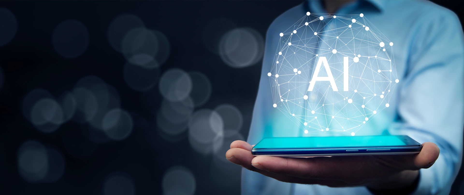 A hand is holding a device with AI bubble